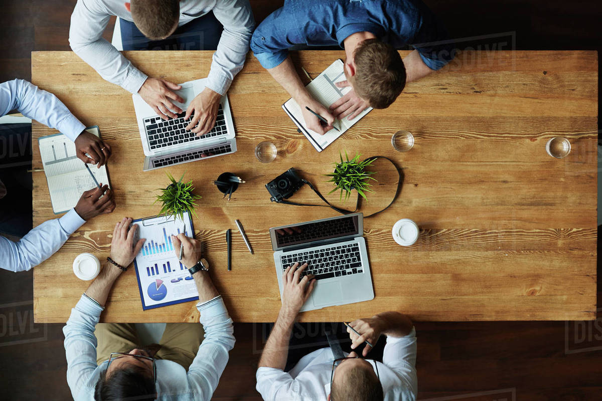 Group of co-workers planning and entering data Royalty-free stock photo