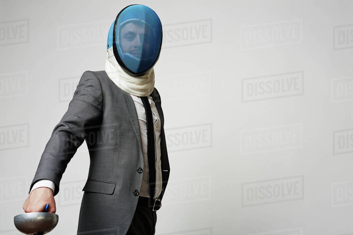 Portrait of businessman in mask and sword Royalty-free stock photo