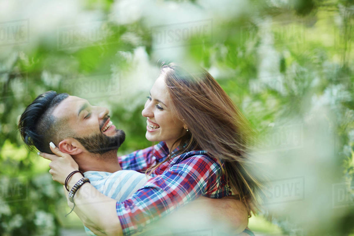 Ecstatic young couple enjoying time in park Royalty-free stock photo