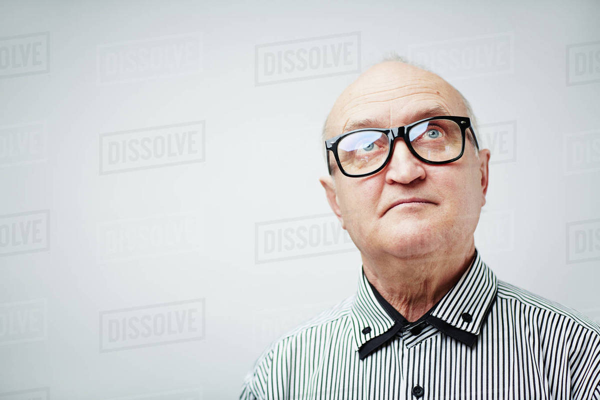 Portrait of senior man in glasses looking up Royalty-free stock photo