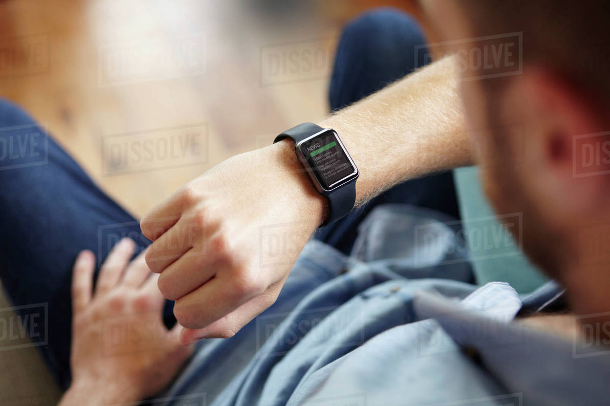 Man Looking At News Application Software On Smart Watch Royalty-free stock photo