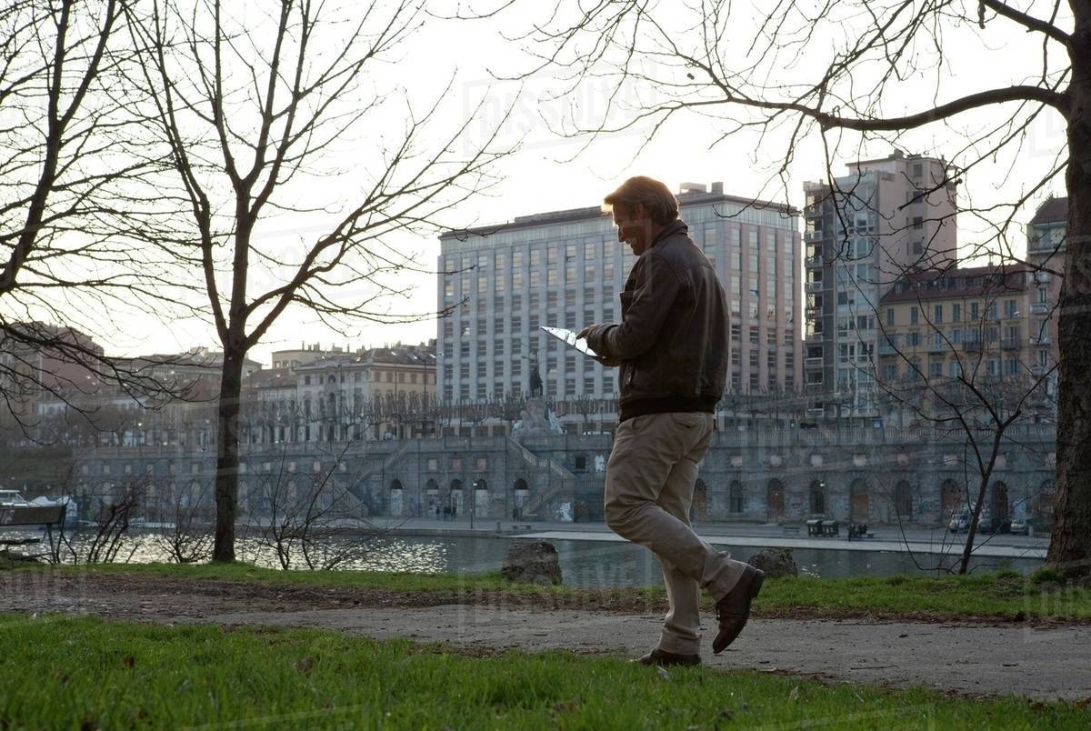 Person walking on the riverside in Piedmont, Italy Royalty-free stock photo