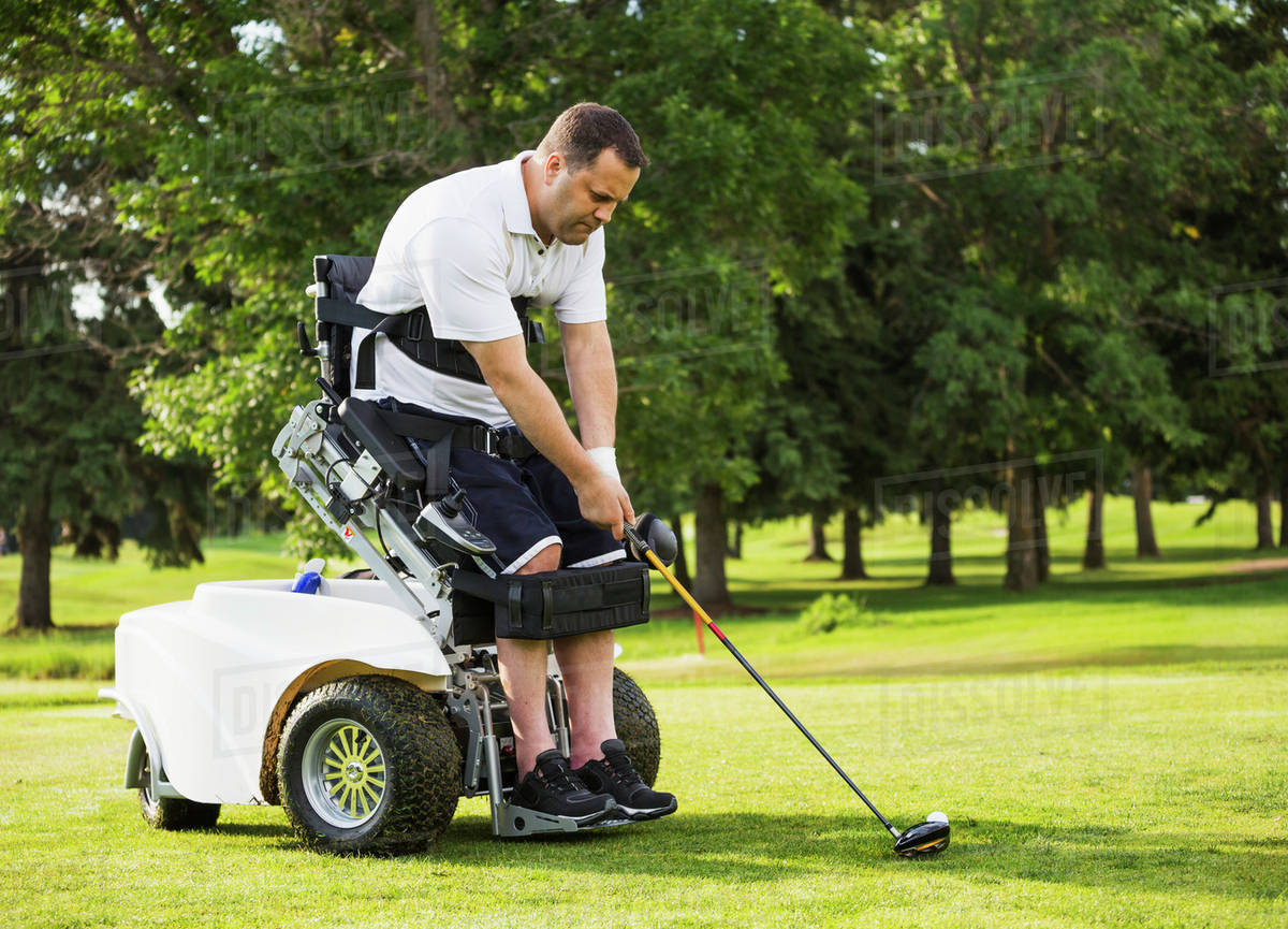 Disabled golfer in a tournament using high tech mobility aid; Edmonton, Alberta, Canada Stock